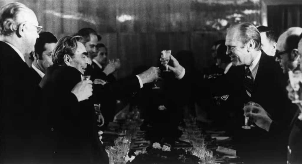 Former U.S. President Gerald Ford and Soviet leader Leonid Brezhnev toast following nuclear nonproliferation talks in 1974. Keystone/CNP/Getty Images